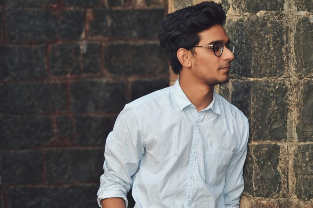 Man in Blue Sports Shirt Wearing Eyeglasses